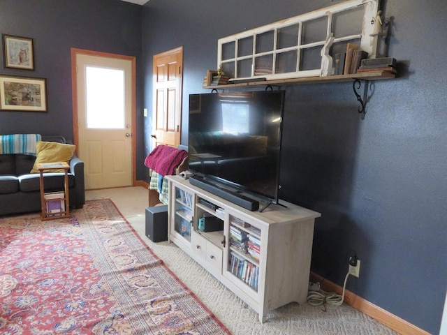 living room with carpet flooring and baseboards