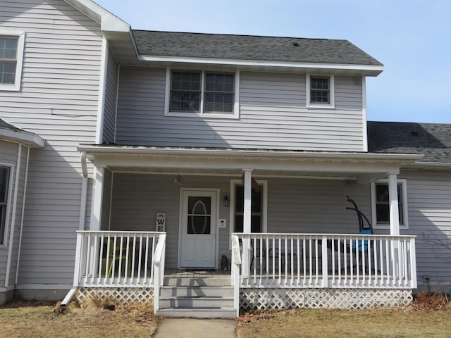 view of front of house featuring a porch and a shingled roof