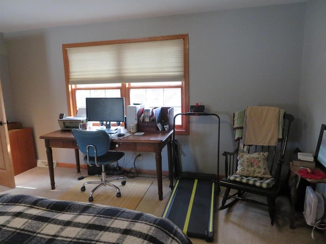 office featuring visible vents, baseboards, and wood finished floors