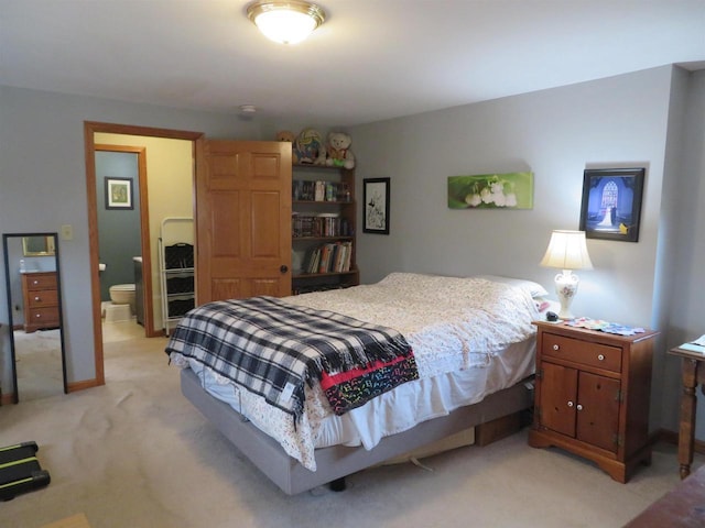 bedroom featuring light colored carpet and baseboards