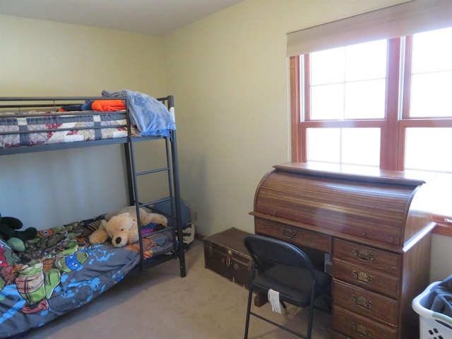 bedroom featuring carpet flooring and multiple windows