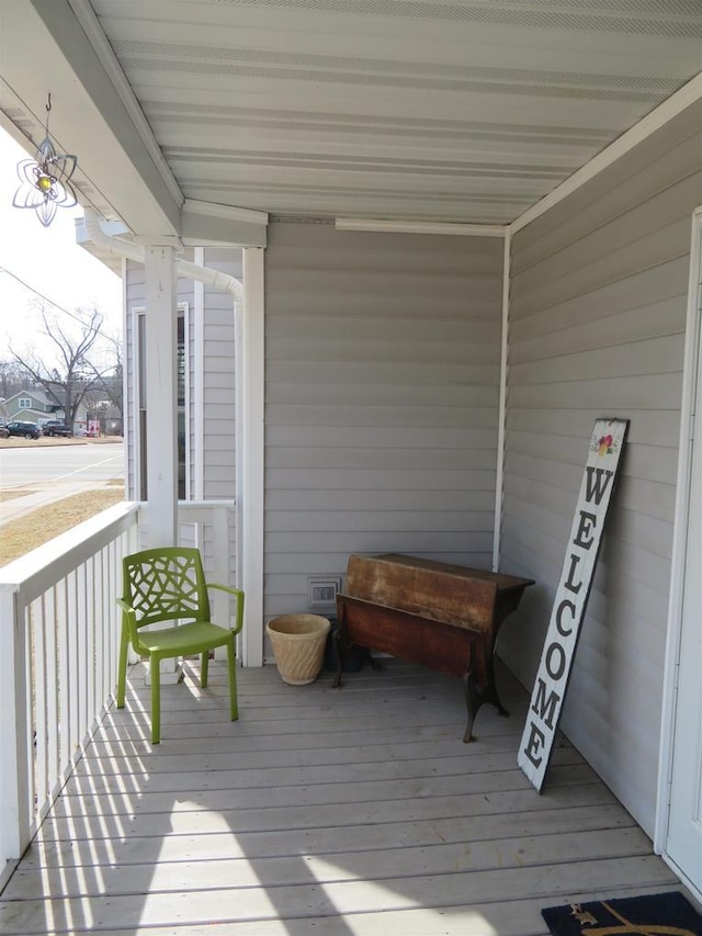 wooden terrace featuring a porch