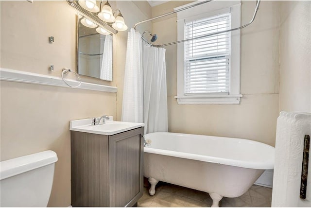 full bathroom with tile patterned flooring, curtained shower, toilet, a bathing tub, and vanity