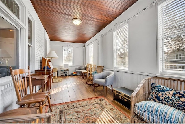 sitting room featuring wood ceiling and hardwood / wood-style floors