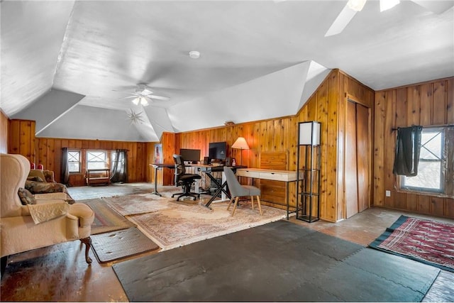 living room with lofted ceiling, wooden walls, and ceiling fan