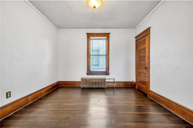 spare room featuring radiator, crown molding, baseboards, a textured ceiling, and wood-type flooring