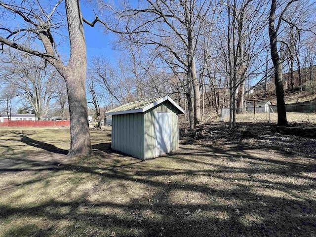 view of shed with fence