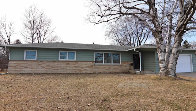 ranch-style home featuring brick siding, concrete driveway, and an attached garage