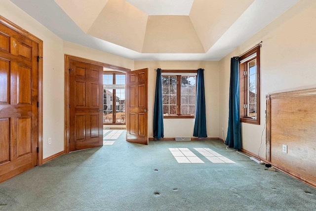 unfurnished bedroom with baseboards, carpet floors, and vaulted ceiling