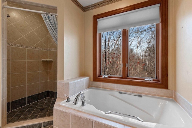 full bathroom featuring a stall shower and a garden tub