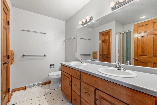 full bath with double vanity, toilet, visible vents, and a sink