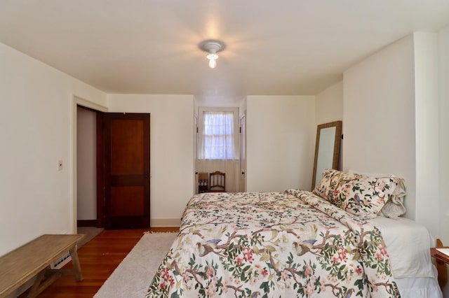 bedroom featuring wood finished floors