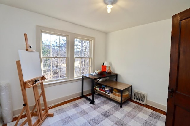 office space with visible vents and baseboards