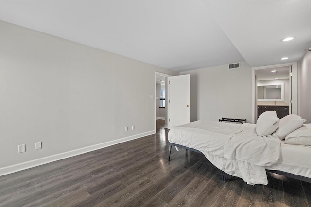 bedroom with dark wood finished floors, visible vents, recessed lighting, and baseboards