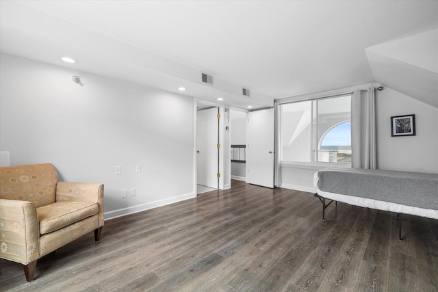 living area with recessed lighting, visible vents, baseboards, and wood finished floors