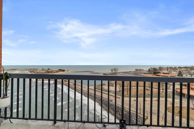 balcony featuring a water view