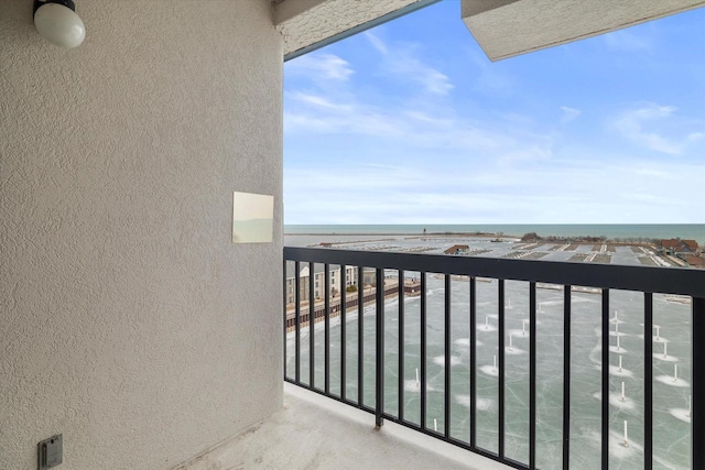 balcony featuring a water view