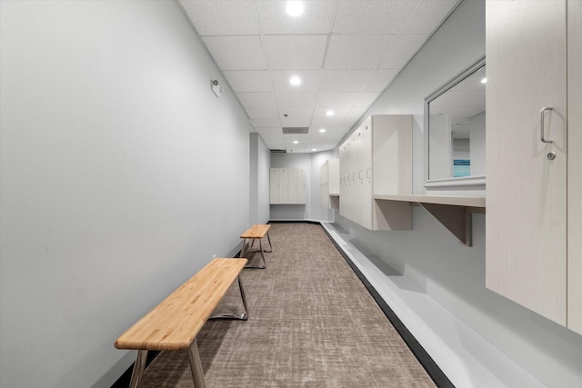 corridor featuring recessed lighting and a paneled ceiling