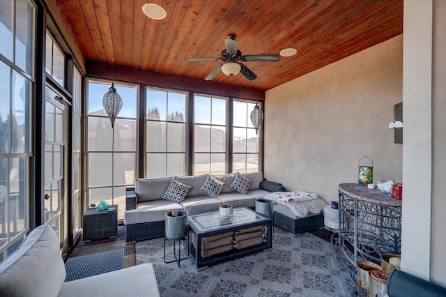 sunroom with wooden ceiling and a ceiling fan