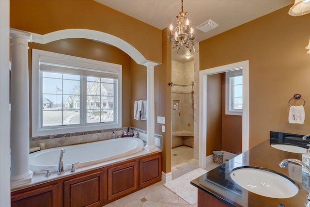 full bath featuring a stall shower, visible vents, ornate columns, and a sink