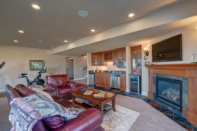 living area featuring recessed lighting, indoor wet bar, and wine cooler