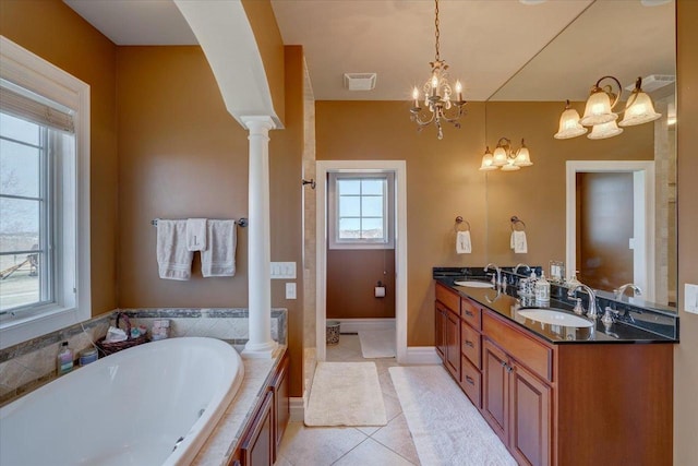 full bath with a sink, decorative columns, visible vents, and tile patterned floors