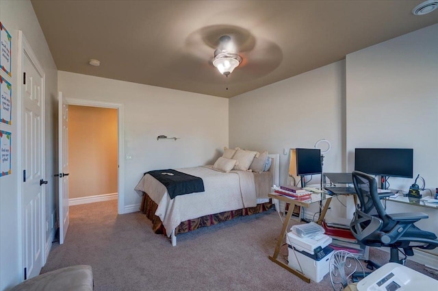 bedroom with baseboards and carpet