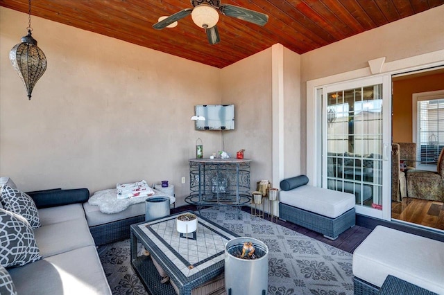 view of patio with outdoor lounge area and ceiling fan