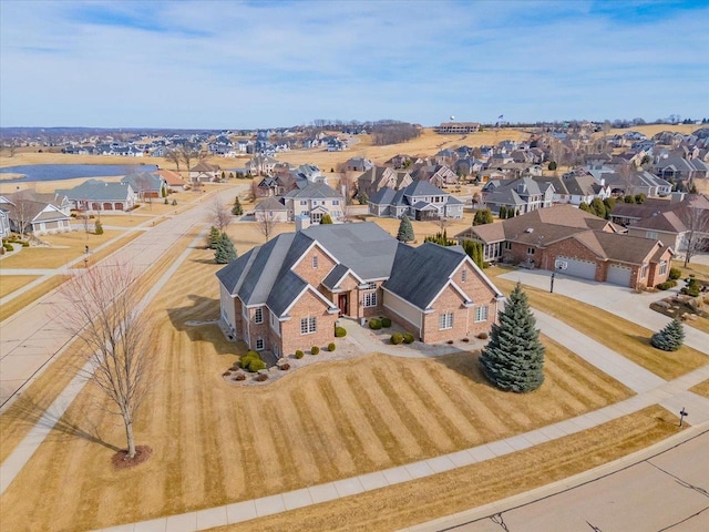 birds eye view of property with a residential view