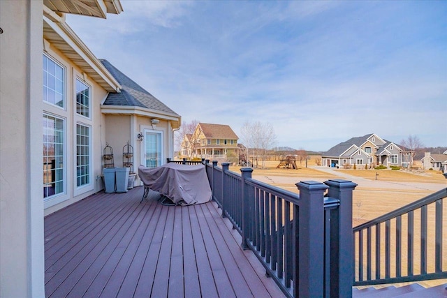 wooden terrace featuring a residential view