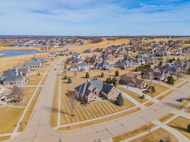 birds eye view of property featuring a residential view and a water view