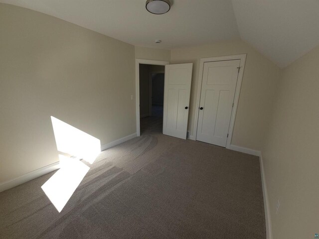 2 S 8th St, Bayfield, WI 54814 - interior space featuring baseboards, lofted ceiling, and carpet