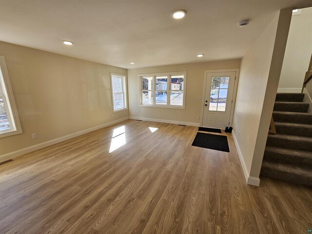 2 S 8th St, Bayfield, WI 54814 - foyer with baseboards, stairs, wood finished floors, and recessed lighting
