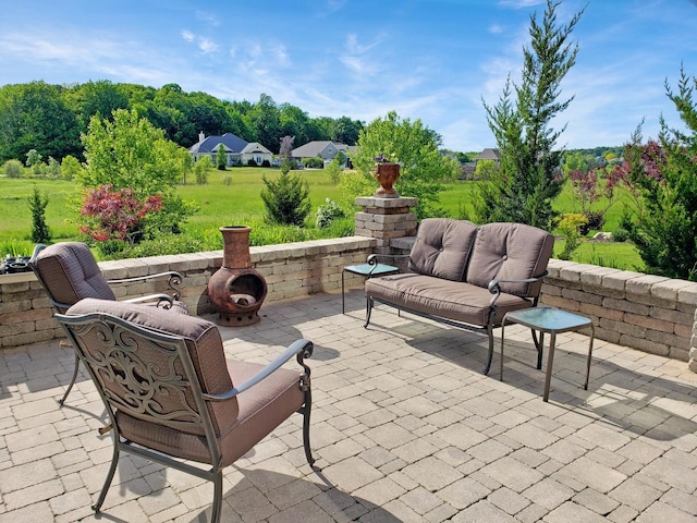 view of patio / terrace featuring an outdoor fire pit