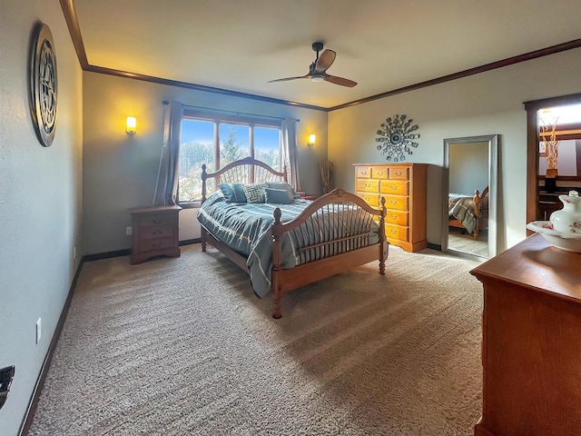 carpeted bedroom with baseboards, ceiling fan, and crown molding