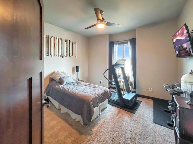 bedroom with baseboards, a ceiling fan, and carpet flooring