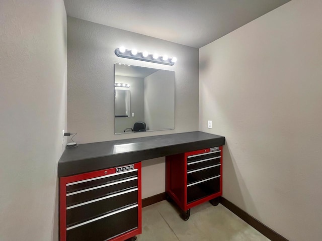 bathroom with vanity and baseboards