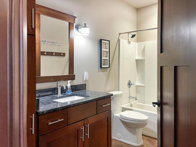 full bath featuring bathing tub / shower combination, toilet, and vanity