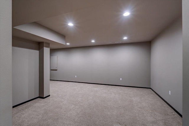 finished basement with recessed lighting, baseboards, and light carpet