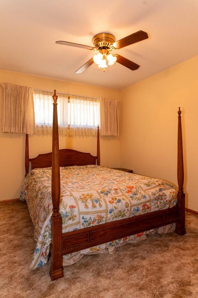 carpeted bedroom featuring a ceiling fan