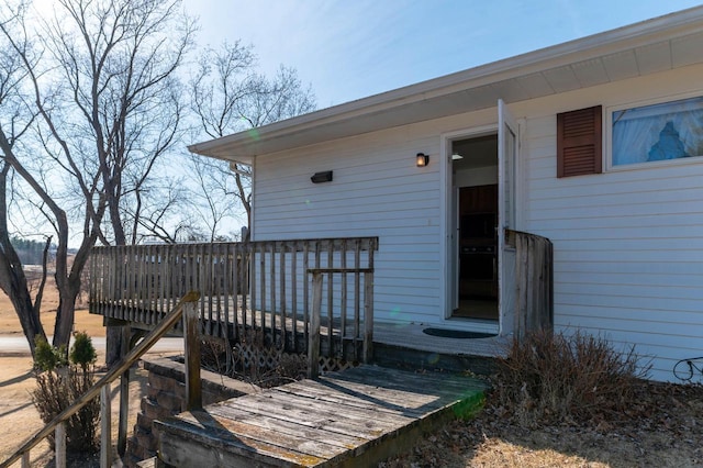 doorway to property featuring a wooden deck