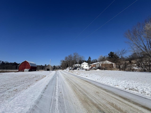 view of street featuring a barn