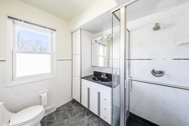 full bathroom with visible vents, toilet, tile walls, and a shower stall