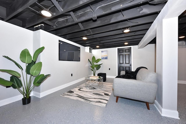 interior space featuring speckled floor and baseboards