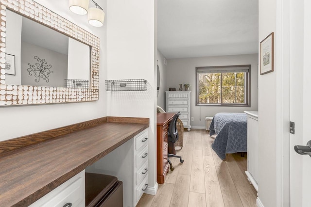 bedroom with light wood-type flooring