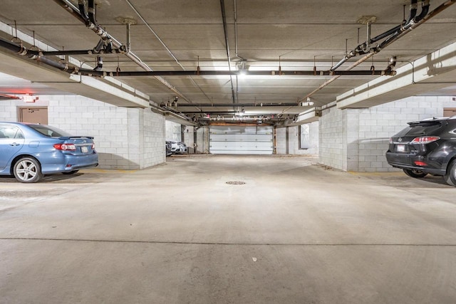 parking garage featuring concrete block wall