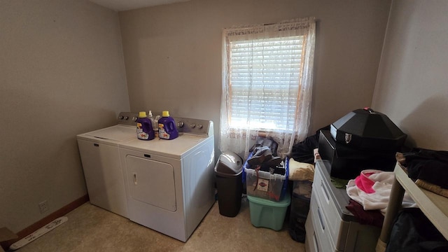 clothes washing area with laundry area and washer and clothes dryer