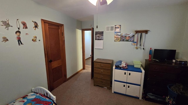 bedroom with visible vents, carpet flooring, baseboards, and ceiling fan