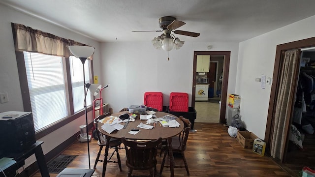 dining area featuring a ceiling fan and wood finished floors