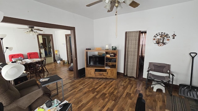 living room featuring wood finished floors and ceiling fan